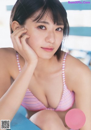 A woman in a bikini on the cover of a magazine.